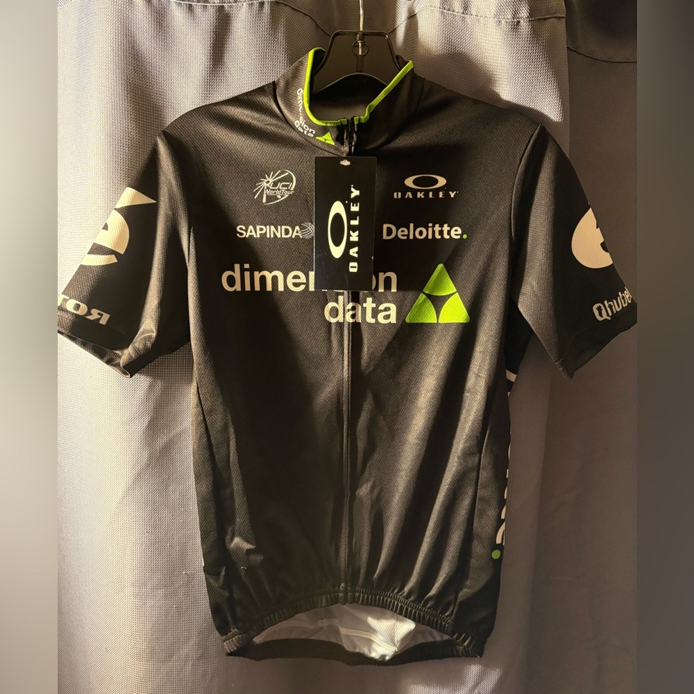 New - Black Oakley Cycling Jersey. Size 2. Dimension Data.